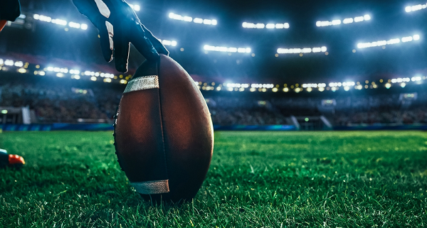 American football on pitch ready to be kicked