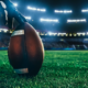 American football on pitch ready to be kicked