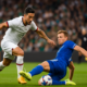 footballer making tackle as player runs past him