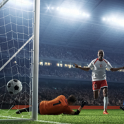 Footballer scoring goal