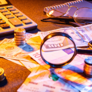 money calculator glasses on desk