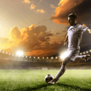 footballer kicking ball