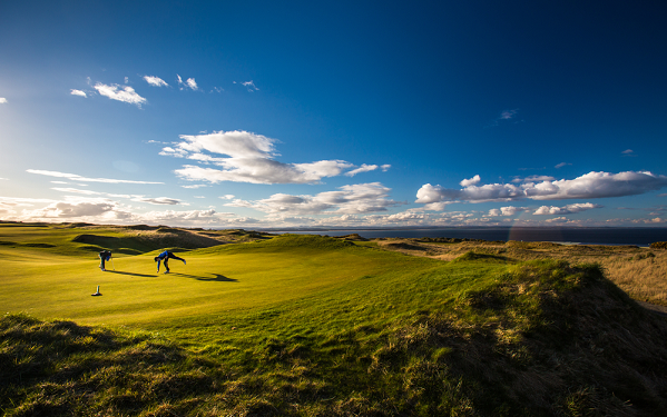 Golfers playing on links course