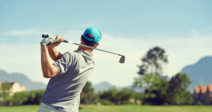 golfer swinging club