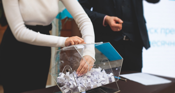 woman turning lottery wheel