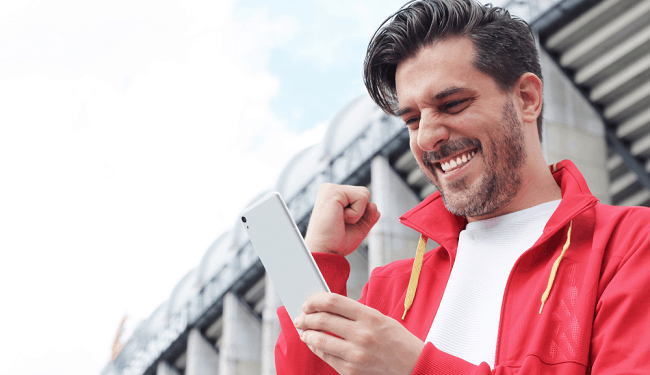 man celebrates betting win