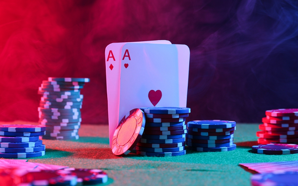 poker table, two aces and poker chips