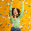 woman celebrating win with confetti falling down
